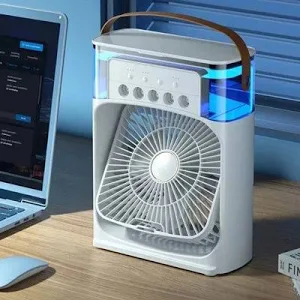 3-in-1 Mini Air Cooler Fan on desk next to laptop